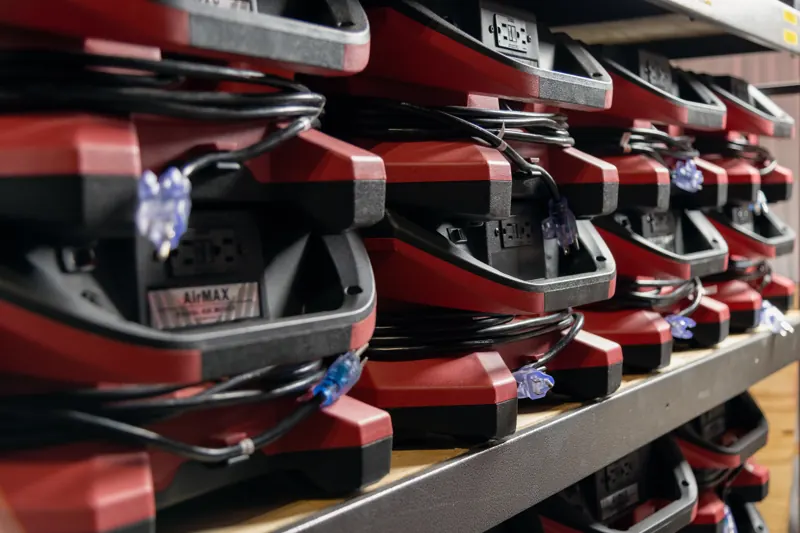 Air movers and drying equipment ready on Flood Rescue's warehouse shelves